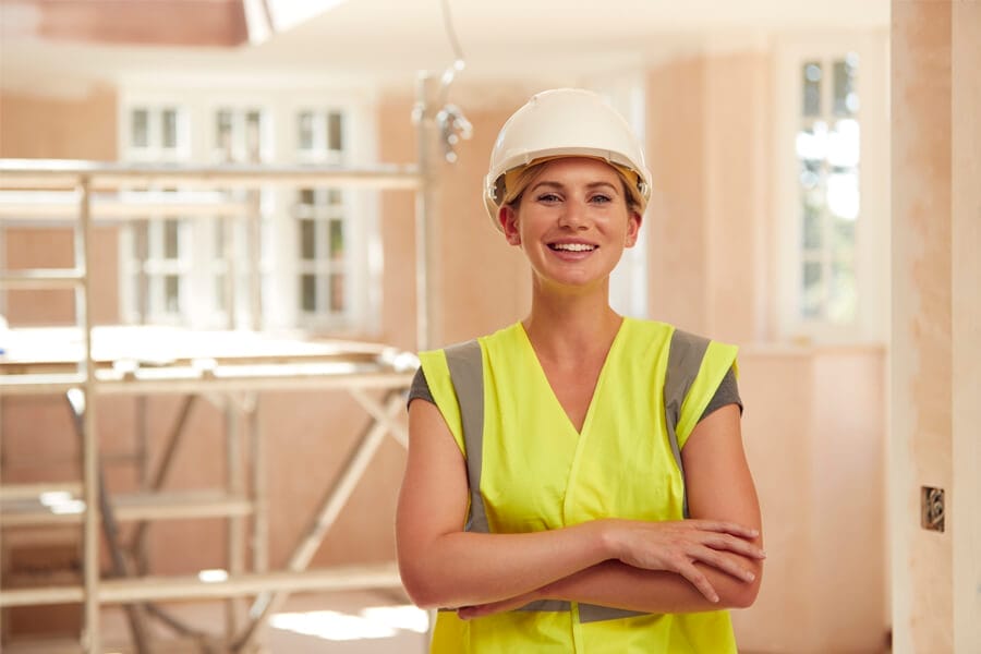 portrait-of-smiling-female-builder-wearing-hard-ha-MD47W97 Female inspector engineer